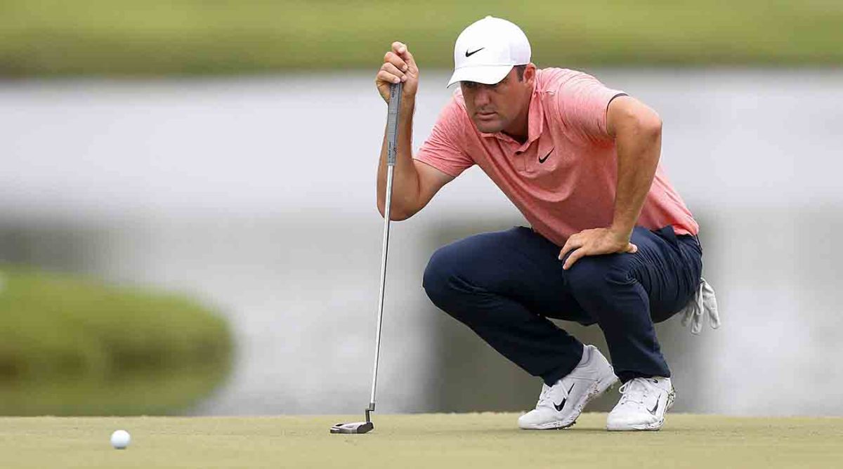 Scottie Scheffler plans out his putt on the 12th hole during the first round of the 2023 FedEx St. Jude Championship at TPC Southwind in Memphis, Tenn.
